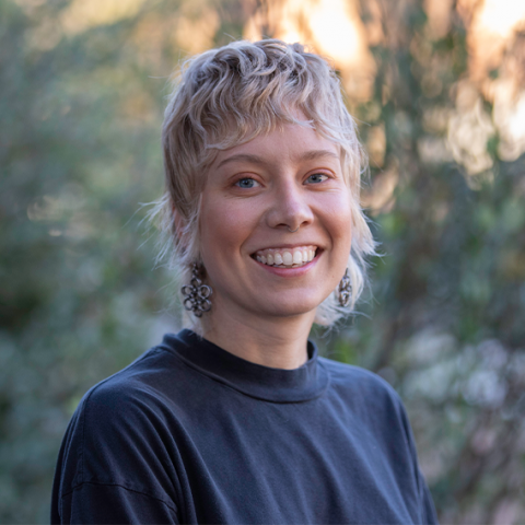 Blonde woman in black shirt